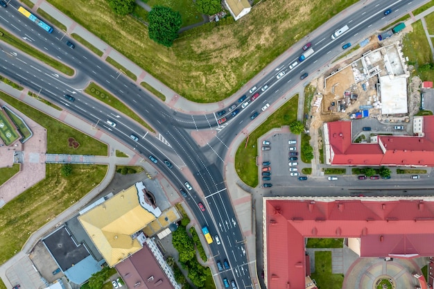 Aerial view of road junction with heavy traffic at city