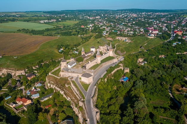 Aerial view of the romantic stone medievel castle on top of the mountain