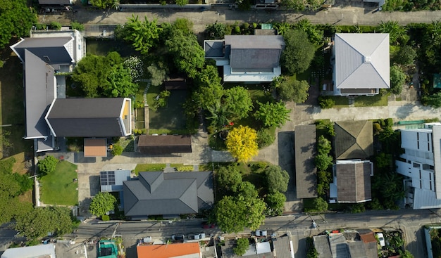 Aerial view of the roof of a house with a car taken by a drone top view of road