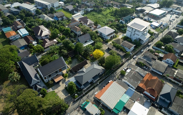 Aerial view of the roof of a house with a car taken by a drone top view of road