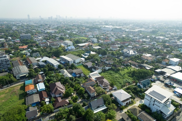 Aerial view of the roof of a house with a car taken by a drone top view of road