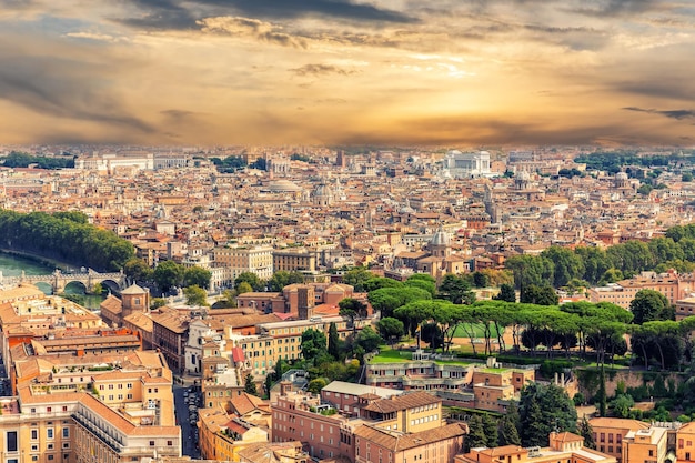 Aerial view of the roofs of Rome main sights at sunset Italy