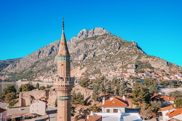 Aerial view over rooftops and mosque minaret in Egirdir Isparta province in Turkey Travel sightseeing and religious tourism