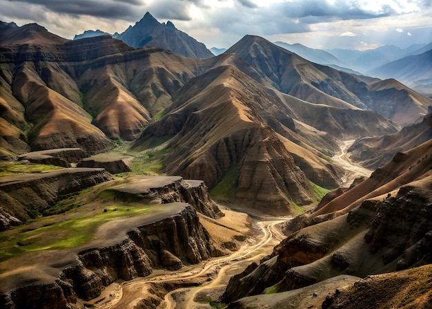 Photo aerial view of rugged mountain terrain with deep valleys and steep slopes