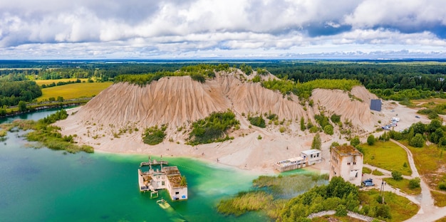 Aerial view of the Rummu abandoned prison Tallinn Estonia lake beach. Beautiful view of the lake