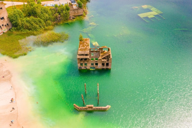 Aerial view of the Rummu abandoned prison Tallinn Estonia lake beach. Beautiful view of the lake.