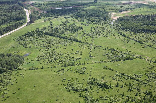 Aerial View Russian meadows roads and fields