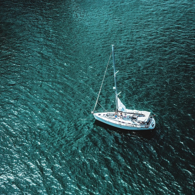aerial view of sailboat sailing on sea