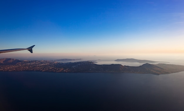 Aerial view of Santorini island as seen from plane window