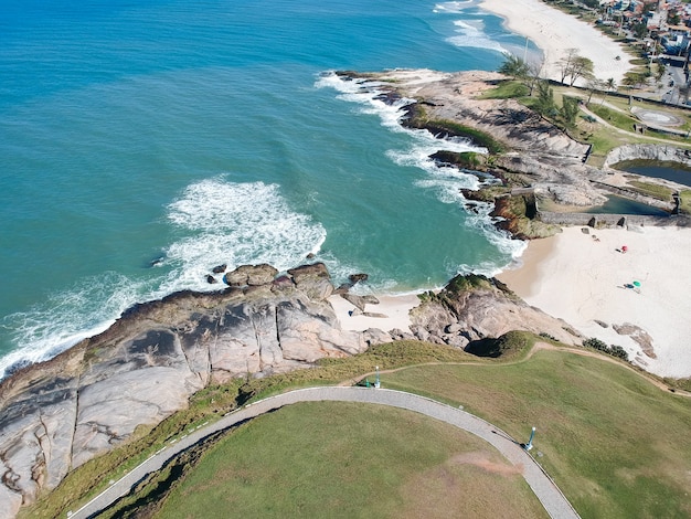 Aerial view of Saquarema and ItaÃÂºna beach in Rio de Janeiro. Famous for the waves and the church on top of the hill. Sunny day. drone photo.