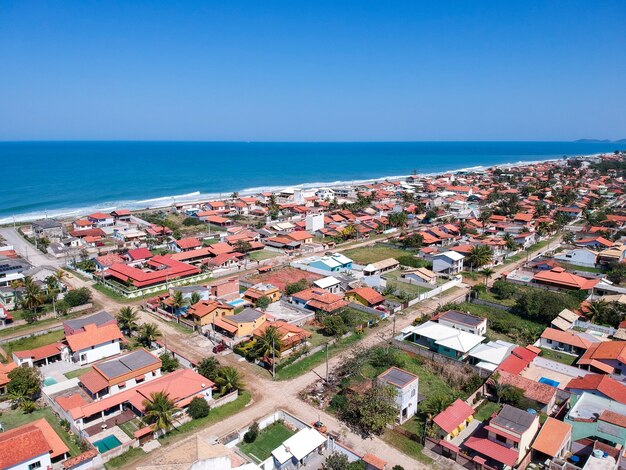 Aerial view of Saquarema and ItaÃÂºna beach in Rio de Janeiro. Famous for the waves and the church on top of the hill. Sunny day. drone photo.