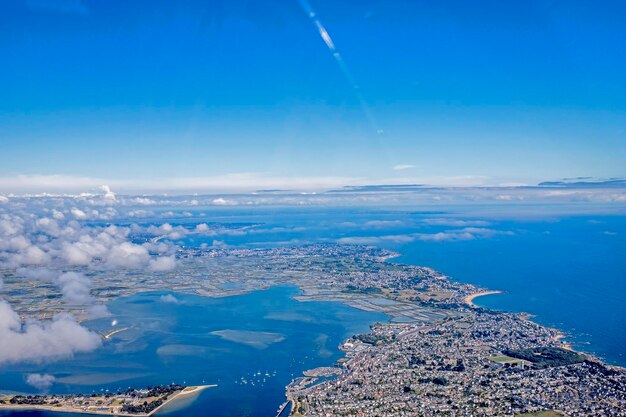 Aerial view of sea against cloudy sky