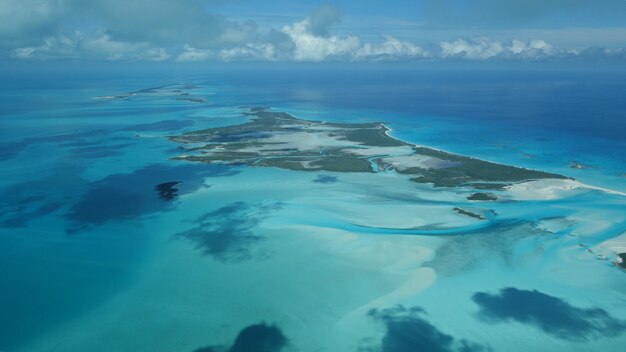 Aerial view of sea and landscape against sky