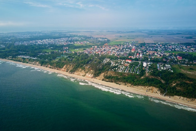 Aerial view of sea landscape with sand beach in Wladyslawowo Baltic sea coastline in Poland Resort town in summer season