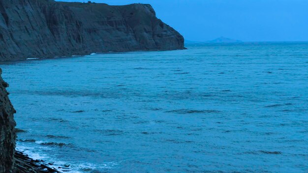 Aerial view of the sea near the coast shot top view of the high cliffs near the sea a raging sea