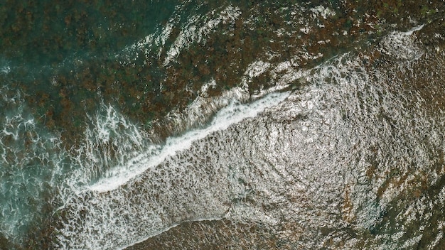 Aerial view of sea water over coral reefs