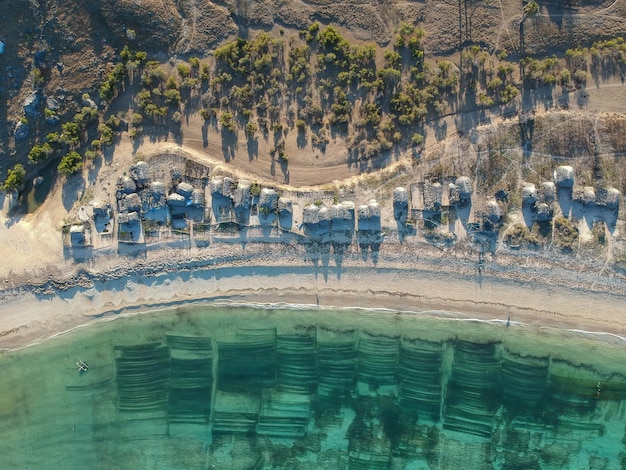 Aerial view, seaweed farmhouse on the coast of the island