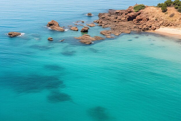 Aerial view of a secluded beach with clear water