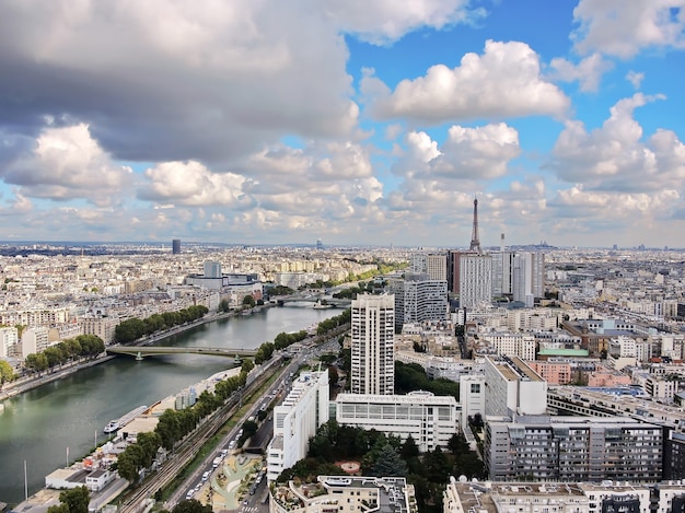 Aerial view of Seine river, buildings and Eiffel tower in Paris, France