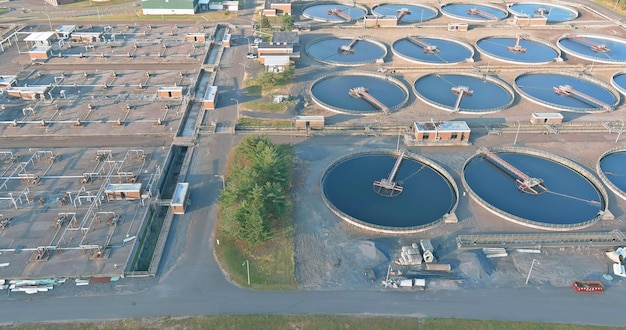 Aerial view of sewage treatment plant water tanks in the wastewater treatment processing after plant