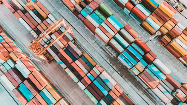 Aerial view of shipping container port terminal. Colourful pattern of containers in harbor. Maritime logistics global inport export trade transportation.