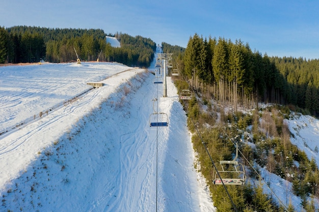 Aerial view of Ski lift on bright winter day 