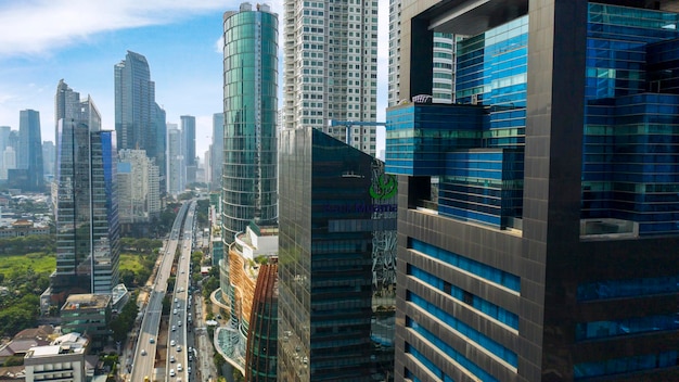 Aerial view of skyscrapers district near a tollway