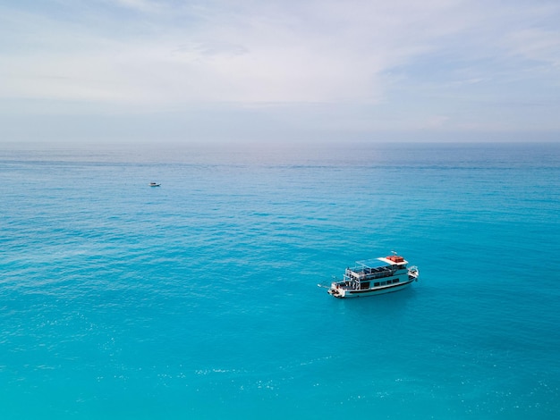 Aerial view of small cruise boat near lefkada island