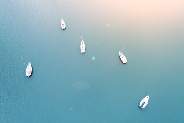 Aerial view of small sailing yachts moored in the lake