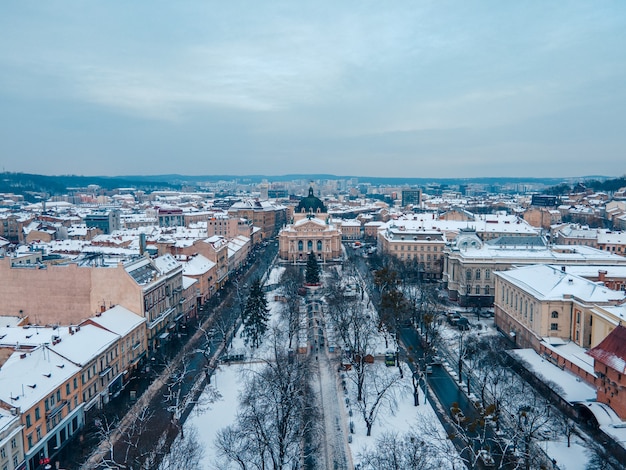 Aerial view of snowed lviv center copy space opera building