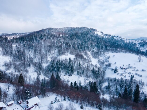 Aerial view of snowed ukrainian carpathian mountains copy space