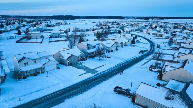 Aerial View of Snowy Suburban Neighborhood at Blue Hour Tranquil Winter Scene