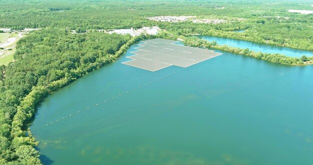 Aerial view solar panels floating in pond