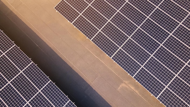 Aerial view of solar panels on top of a building Eco building or factory Solar or photovoltaic cell