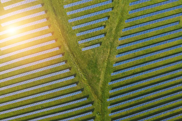 Aerial view of solar power plant. Solar farm system from above. Large photovoltaic power station. Source of ecological renewable energy.