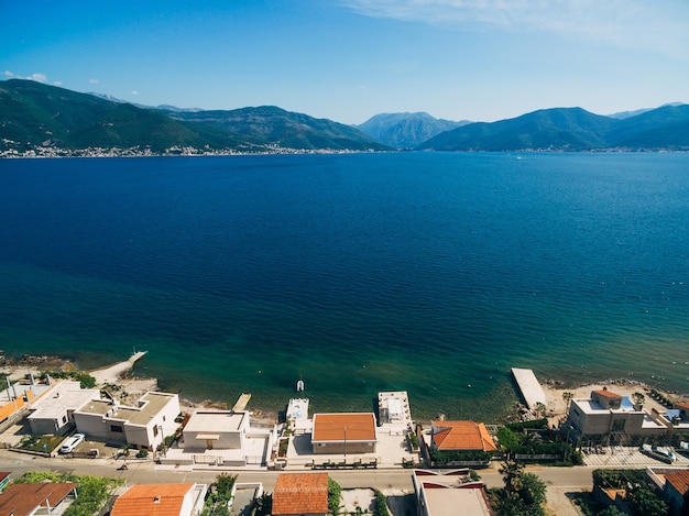 Aerial view of a street with houses on the coast of kotor bay in montenegro