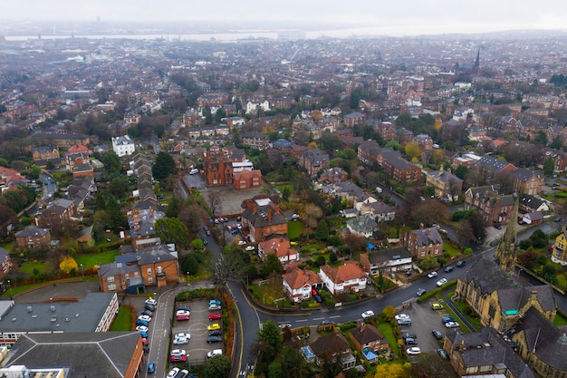 Aerial view over suburban homes and roads in Birkenhead UK