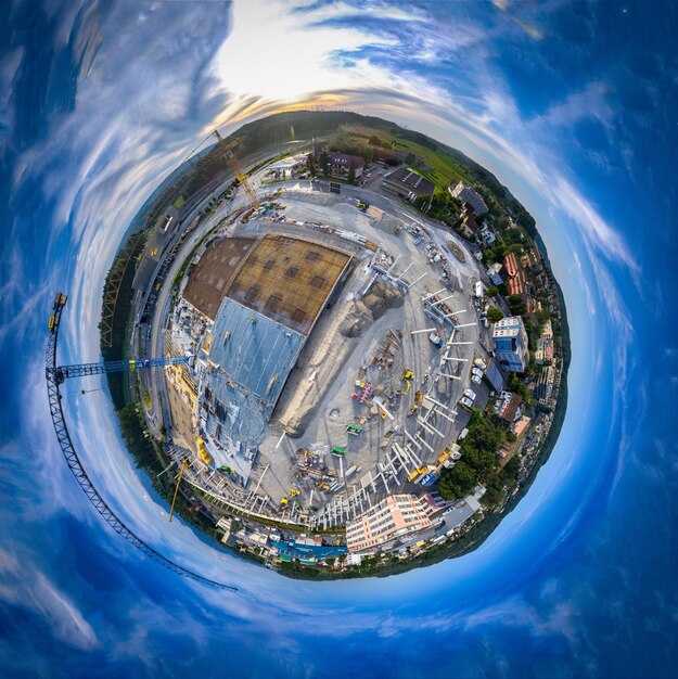 Aerial view of swimming pool in city against sky