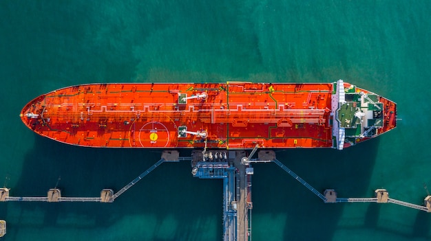 Aerial view tanker ship unloading at port, Business import export oil with tanker ship transportation oil.