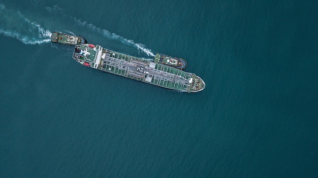 Aerial view tanker ship vessel unloading at port global\
business logistic import export oil and gas petrochemical with\
tanker ship transportation oil from dock refinery