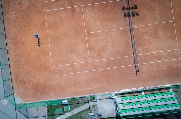 Aerial view of tennis game on court top view