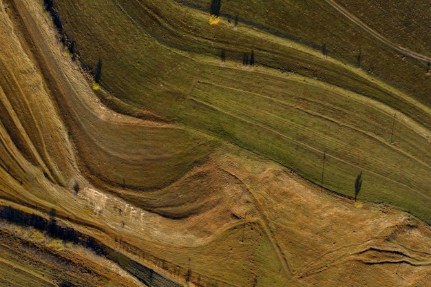 Aerial view of terraced green hills countryside landscape by drone