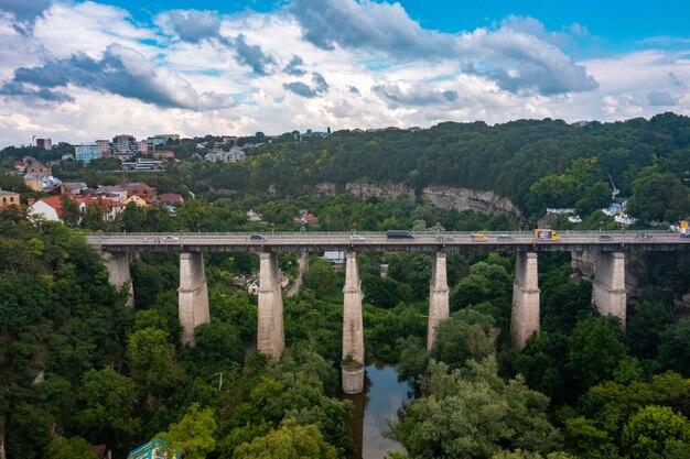 Aerial view of th ebeautiful bridge going over the green valley