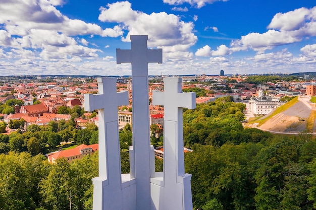 Aerial view of the Three Crosses monument overlooking Vilnius Old Town. Vilnius landscape from the Hill of Three Crosses, located in Kalnai Park, Lithuania.