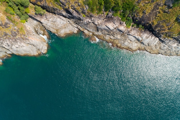 Aerial view Top down seashore Beautiful turquoise sea surface in sunny day Good weather day summer background Beautiful island Phuket Thailand.