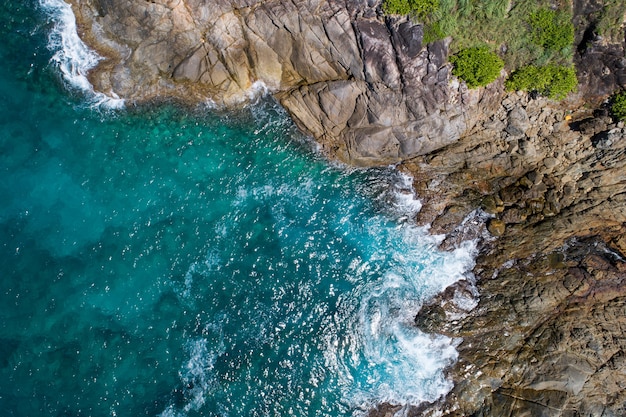 Aerial view Top down seashore wave crashing on seashore Beautiful turquoise sea surface in sunny day Good weather day summer background Amazing seascape top view.