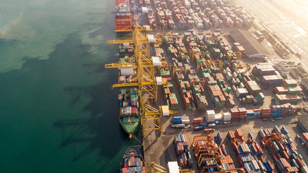 Aerial view or top view of cargo ship, cargo container in warehouse harbor