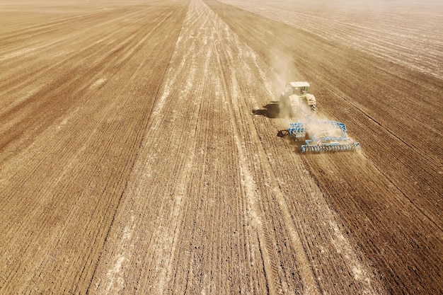 Aerial view Tractor preparing field, Agriculture tractor landscape