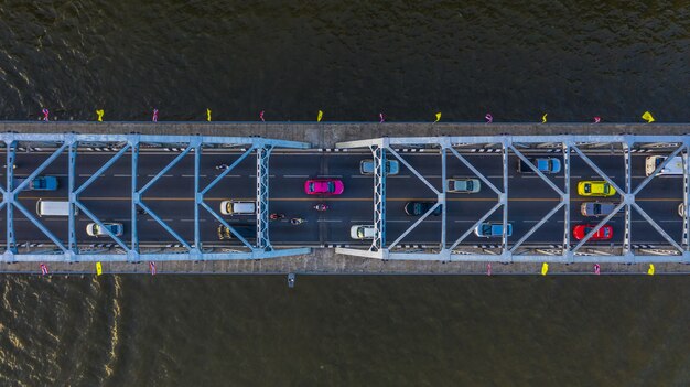 Aerial view on traffic bridge over river, cars on bridge