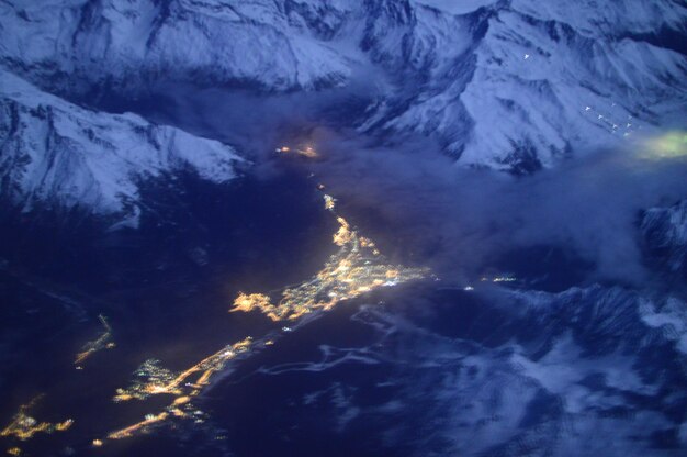 Aerial view of tree mountains against sky